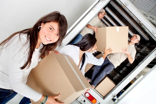 Professional movers planning removals in Osidge with packed household items